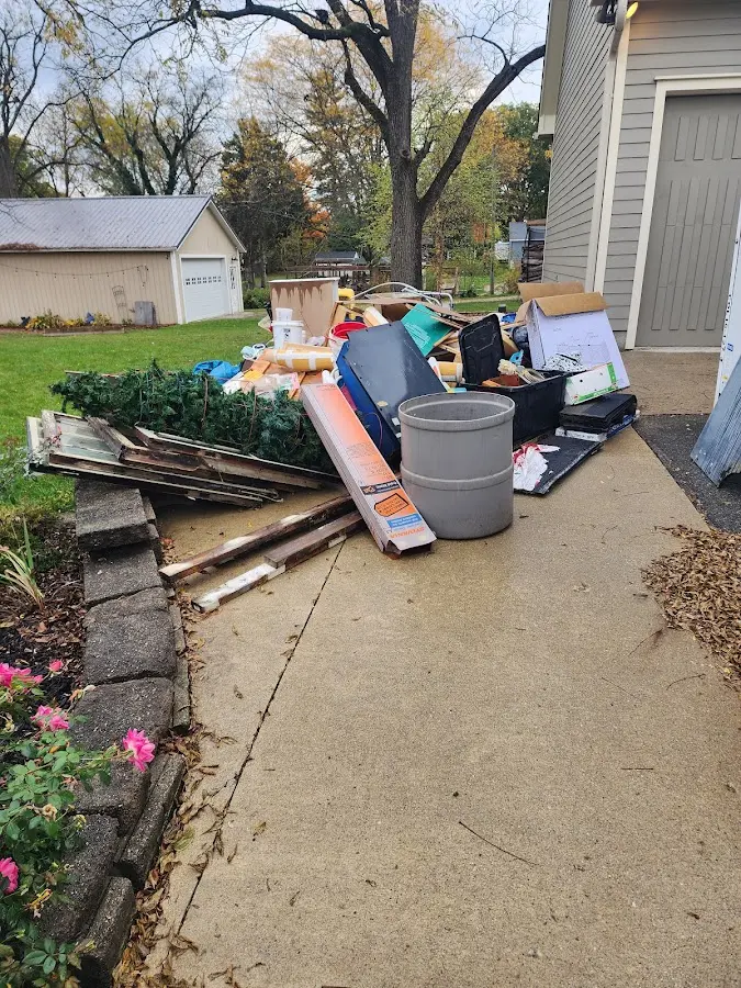Dumpster being loaded with debris for Residential Dumpster Rental in Xenia